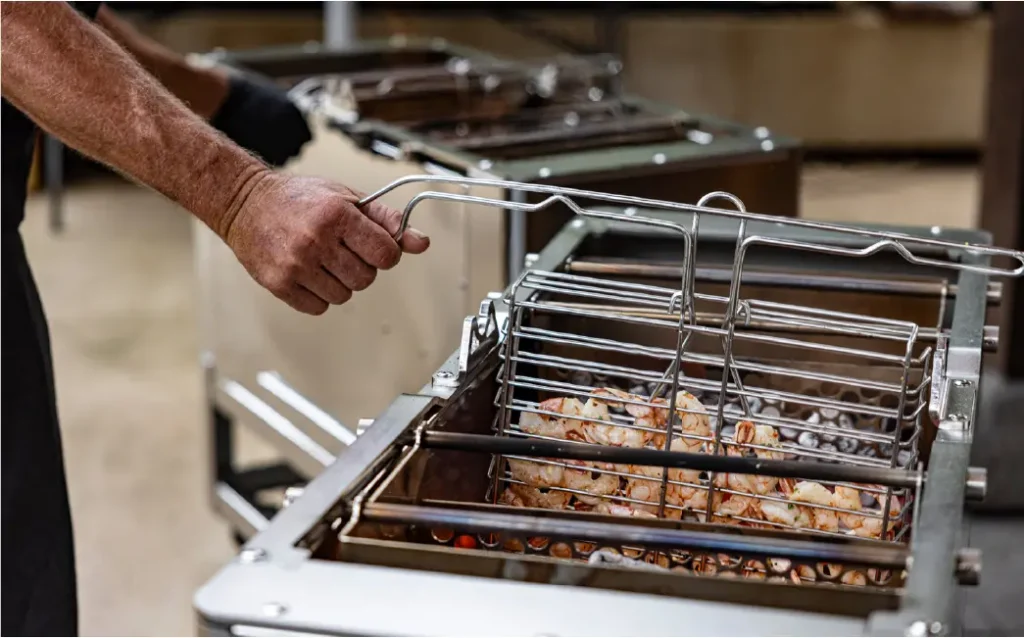 Carne Grill's double-sided vertical charcoal flame grill